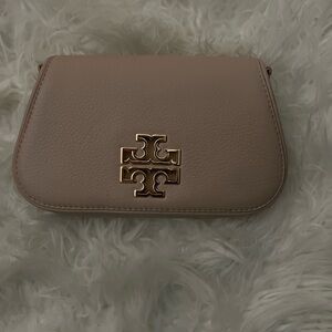 Tory Burch mini Britten bag.Has small scruffs in the back. Check the video